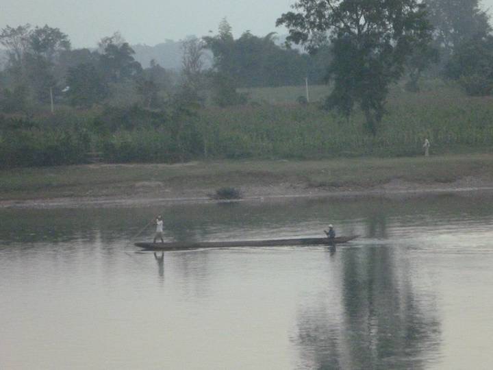 On the river in Hsipaw a long canoe is poled & paddled upstream then fishing nets are cast for the drift downstream.